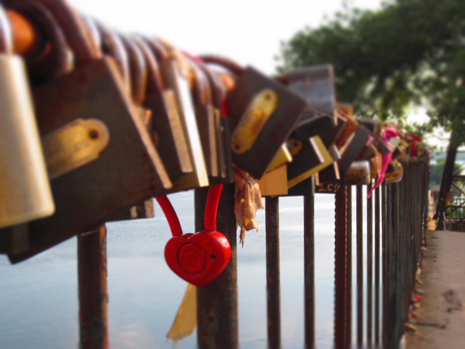 This bridge in Kyiv is completely full of mostly old locks that couples place here as a sign of their commitment. It's the green version of the heart-carved-in-a-tree tradition, if you will.