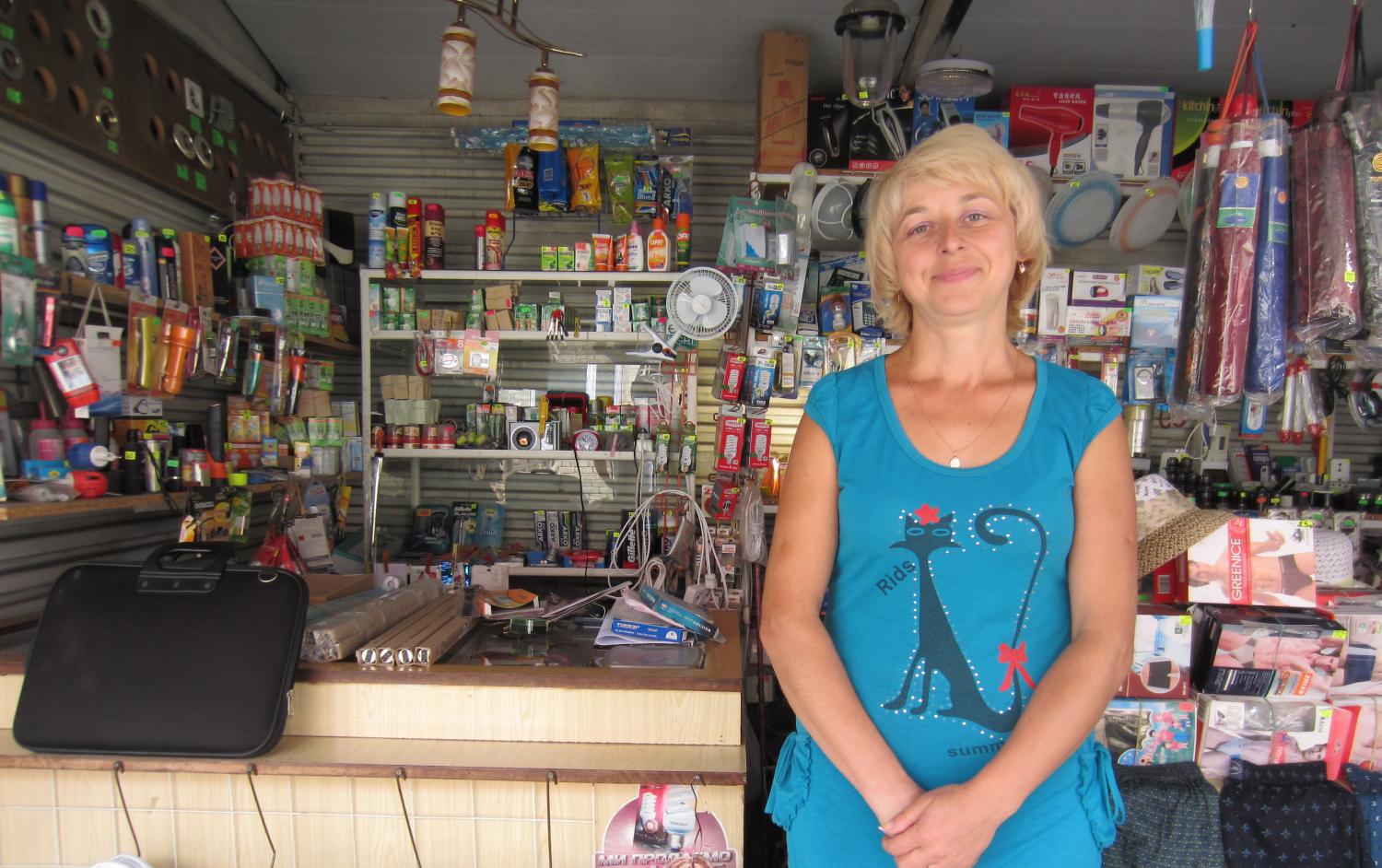 Meet Yelena. She used a Kiva loan to buy goods for her little shop in a nearby outdoor market and told us that she's "very happy" with the growth her loan has provided.