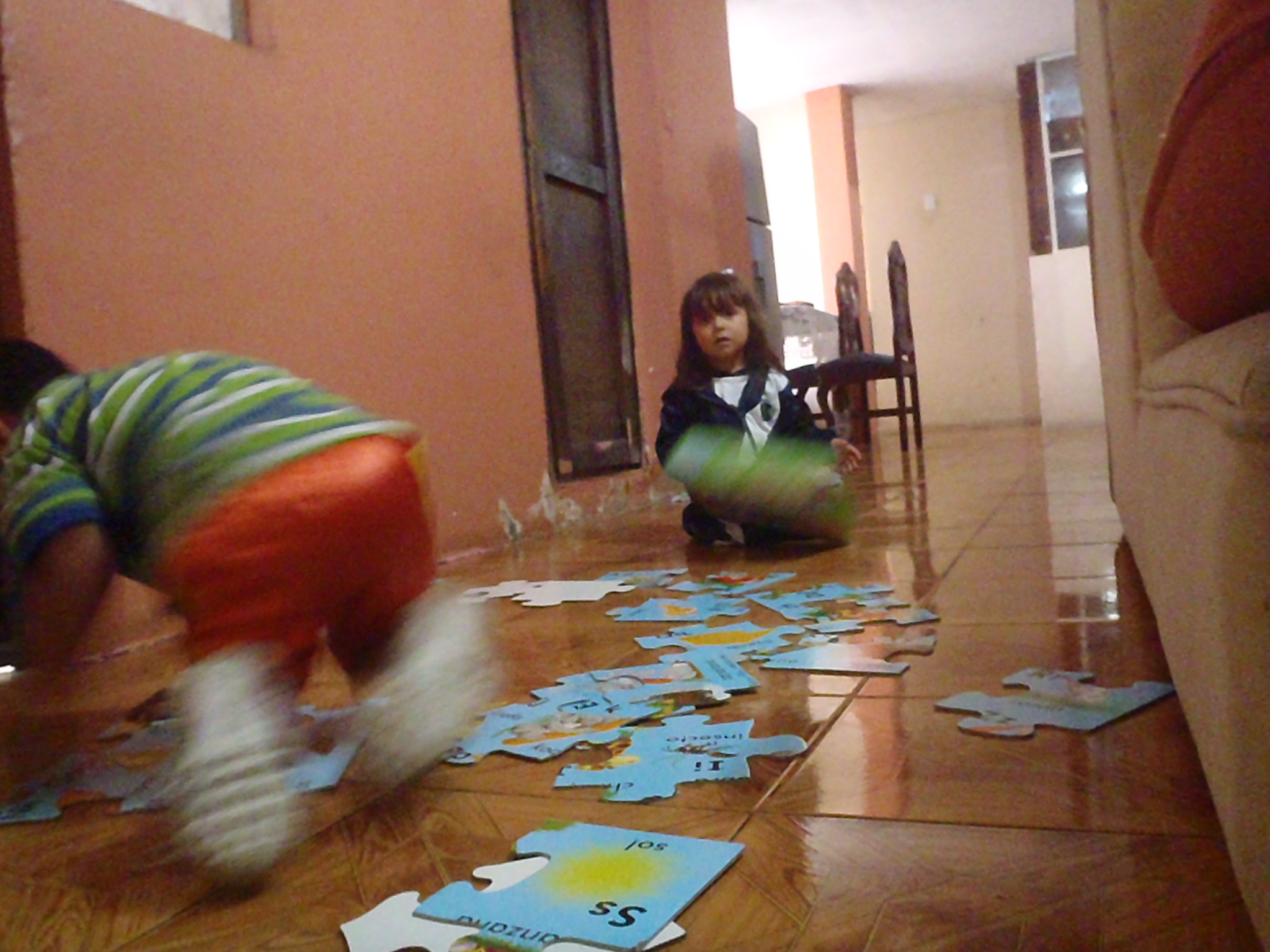 Martin learning his alphabet while we Ivonne works.