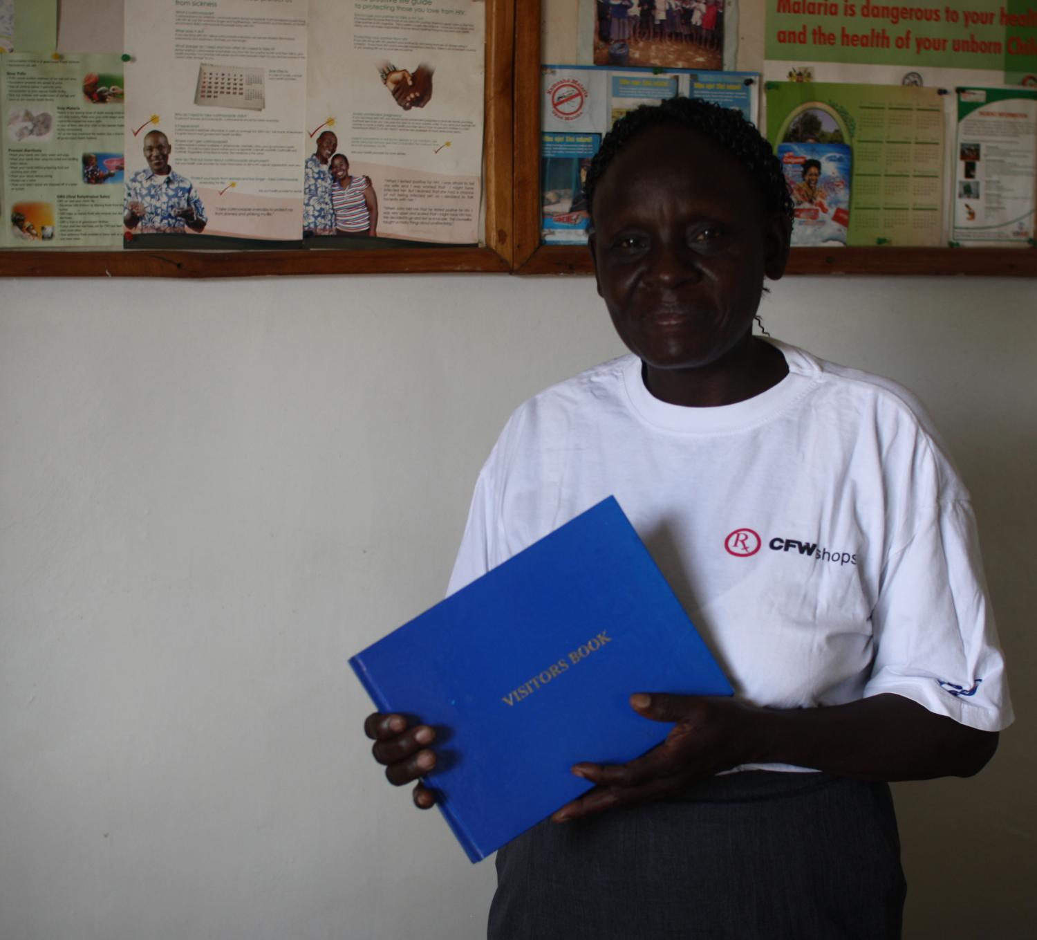 Fosca holding the visitor's book we would later sign.