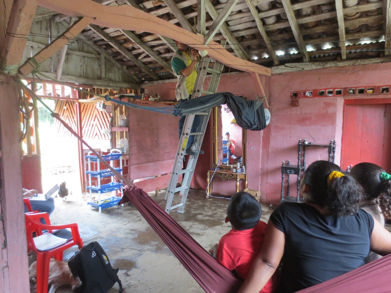 Zobeyda and her kids observing the installation