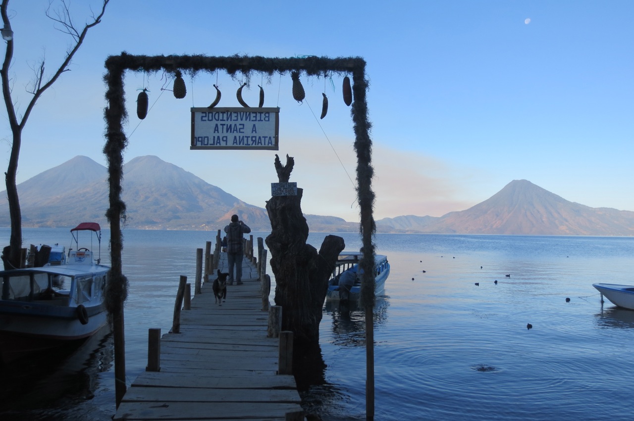 Photo taken in the Guatemalan town of Santa Catarina Palopó, which is situated on Lake Atitlán. In the background are the Atitlán, San Pedro, and Tolimán Volcanoes.