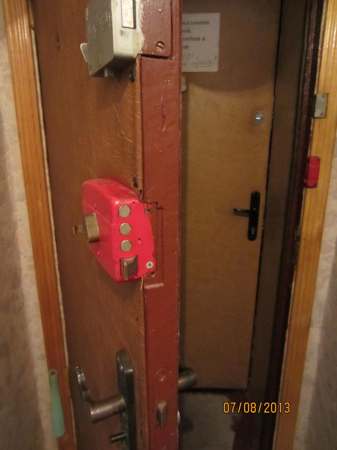 The door to the apartment. The inner door has 4 Soviet-era locks. The outer door has two modern ones. All take different types of keys.