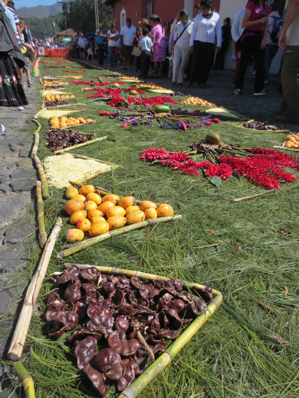 Not all rugs are made of sawdust - pine needles, fruit, nuts, leaves, flowers, and many other things are creatively used
