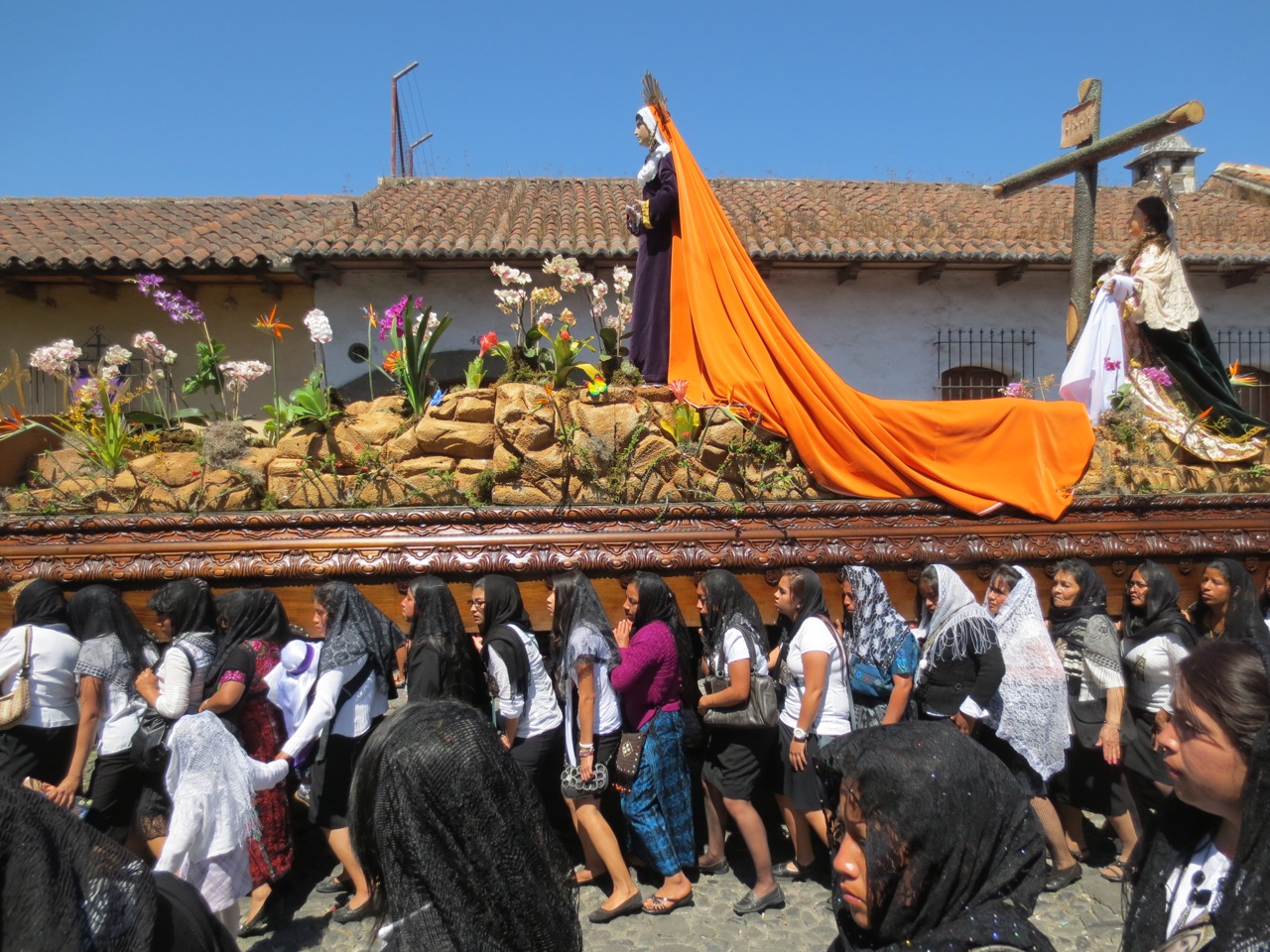 Women carrying a float representing Mary, the mother of Jesus