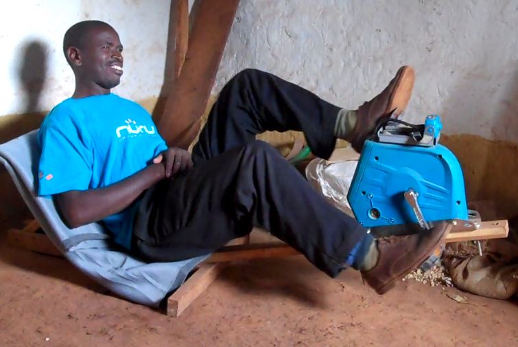 Marco operates his Nuru PowerCycle to charge a headlamp