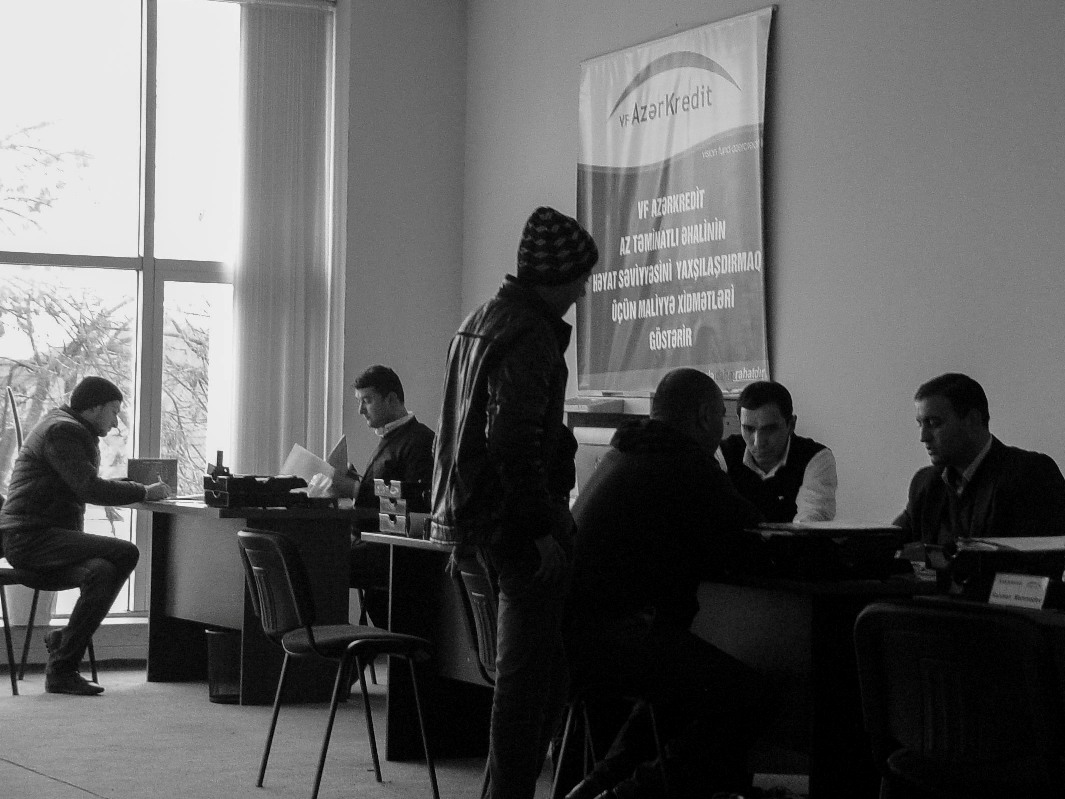 The VF AzerCredit office in Sabirabad. Loan Officers discuss applications with prospective clients. Over 60% of Azerbaijanis borrower money, formally and informally, to make ends meet.