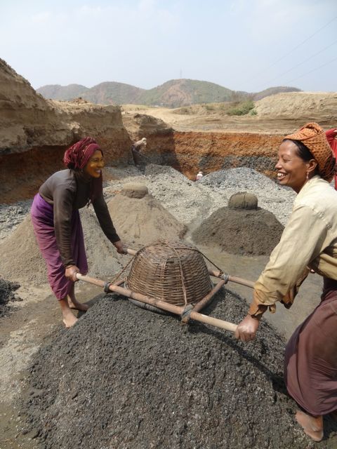 Two of the Kiva borrowers laughing at me for taking millions of photos like the paparazzi.
