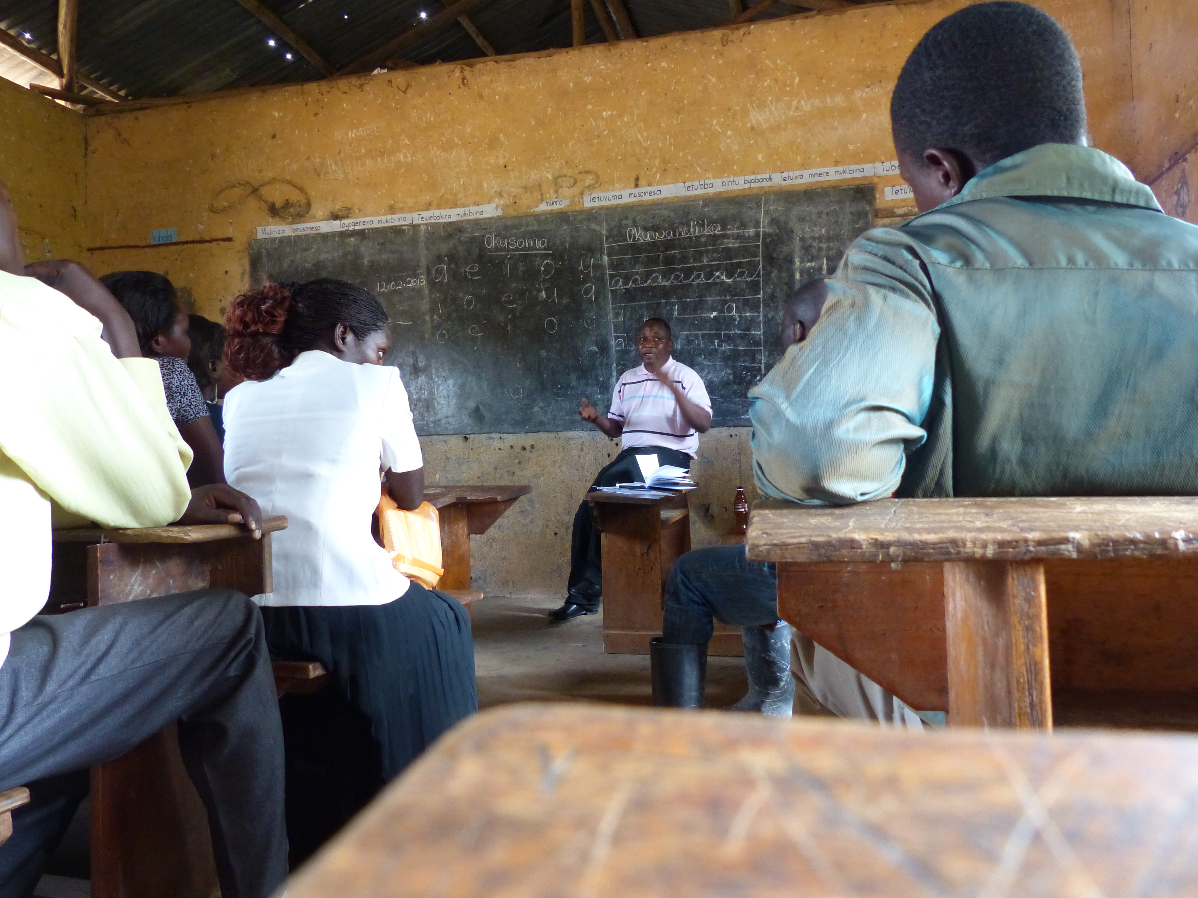 One of our Grameen trainers, Hosea, speaking with Masaka CKWs