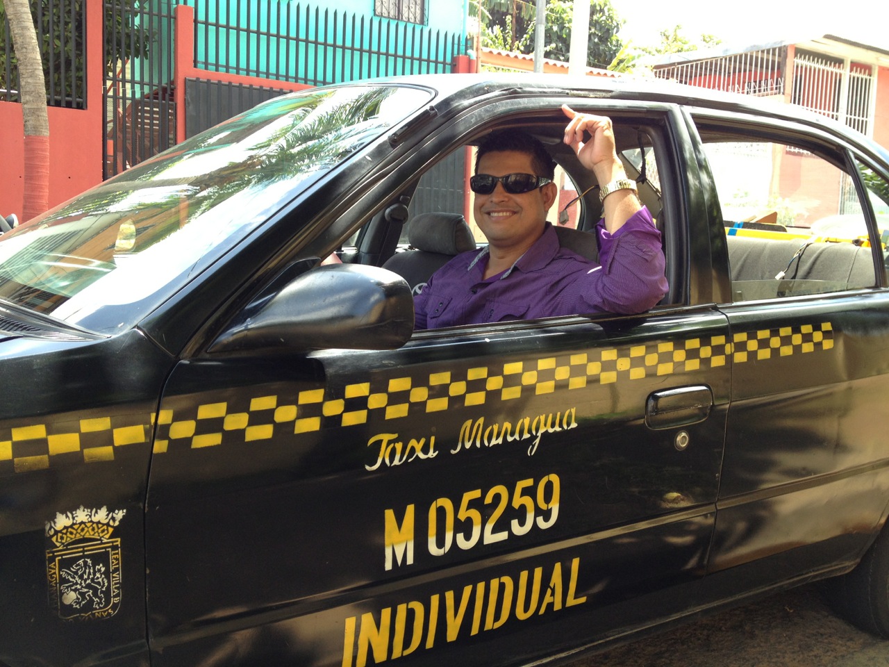 Jesús in his taxi