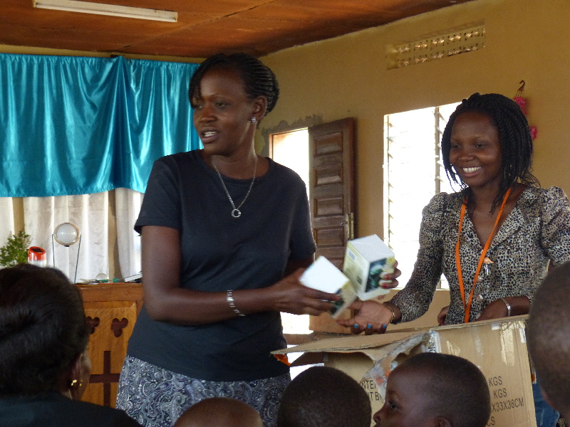 Eva passing out solar lamps