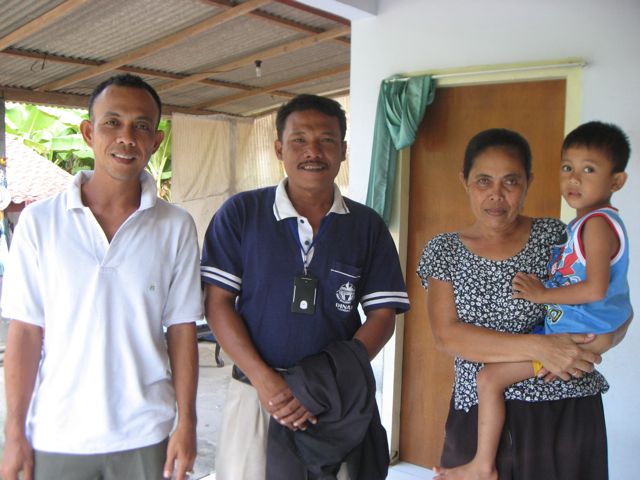 Outside Pak Agus' home Pak Agus, Pak Herman, Pak Agus' mother and young son