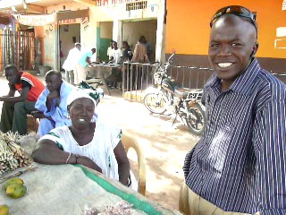 Moussa Moussa, IMCEC Loan Officer, with a Kiva Borrower