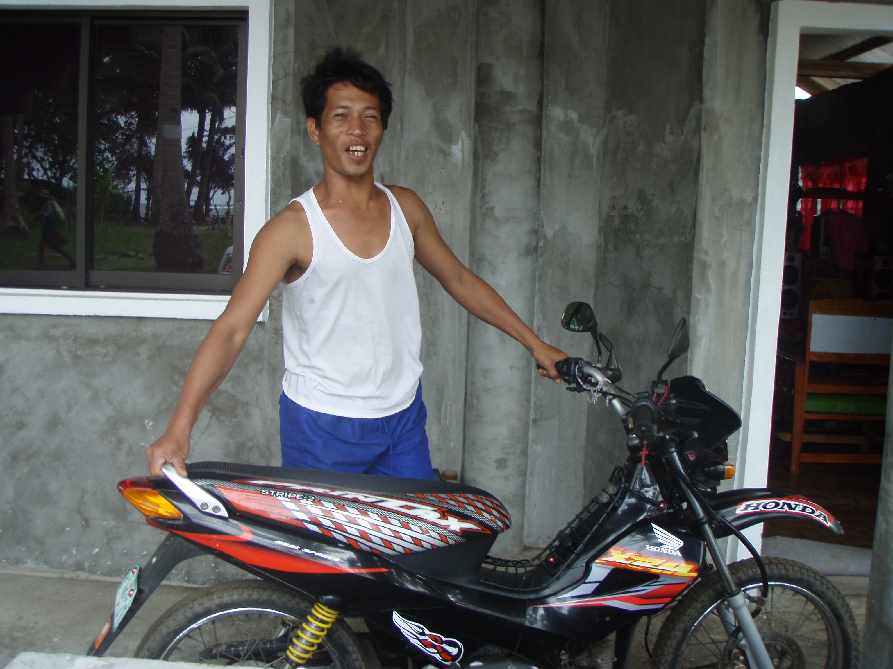 Mr. Morequio and his motorbike Mr. Morequio and his motorbike