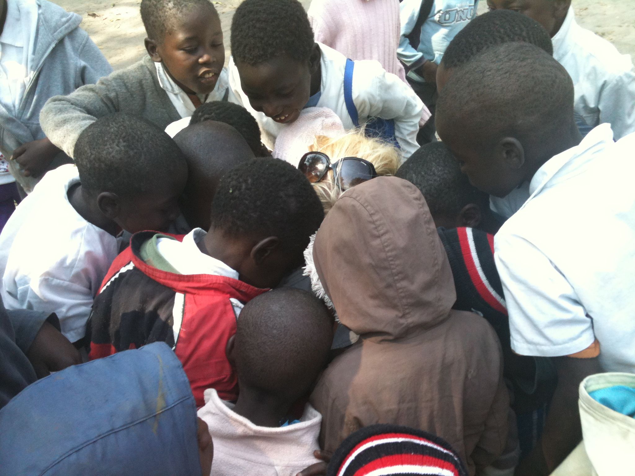 Primary school kids marvel at their own photo and I marvel at their excitement and energy, Botswana