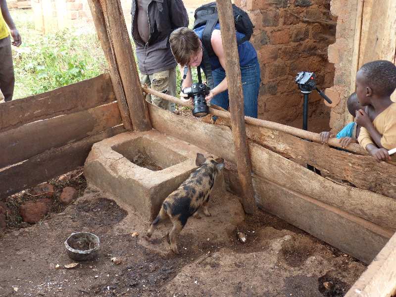 Liz trying to get a shot of "Kiva", Alice's new piglet.