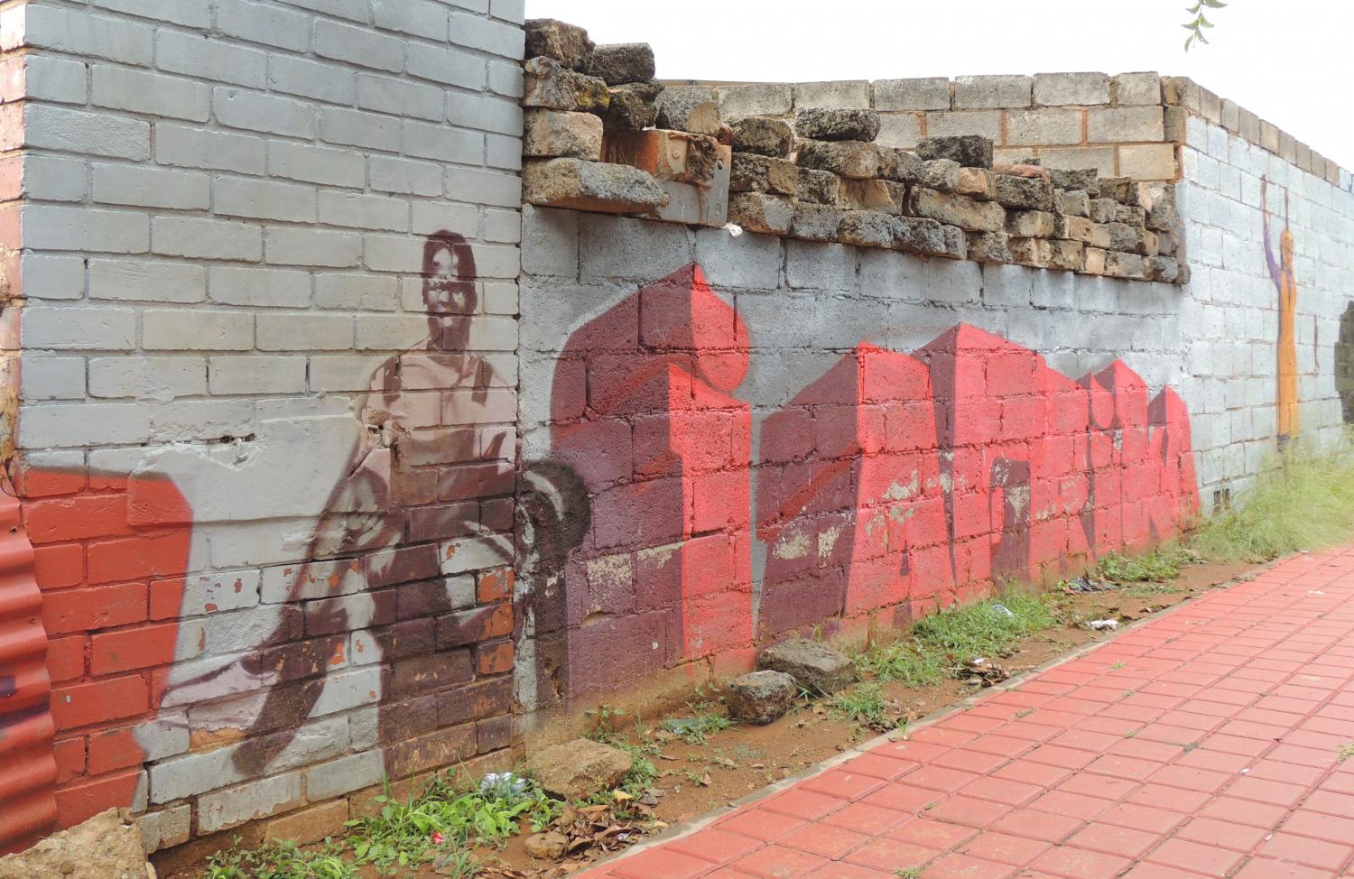 Public art in Soweto honoring the student protests in 1976 where Hector Pieterson and hundreds of others were killed.