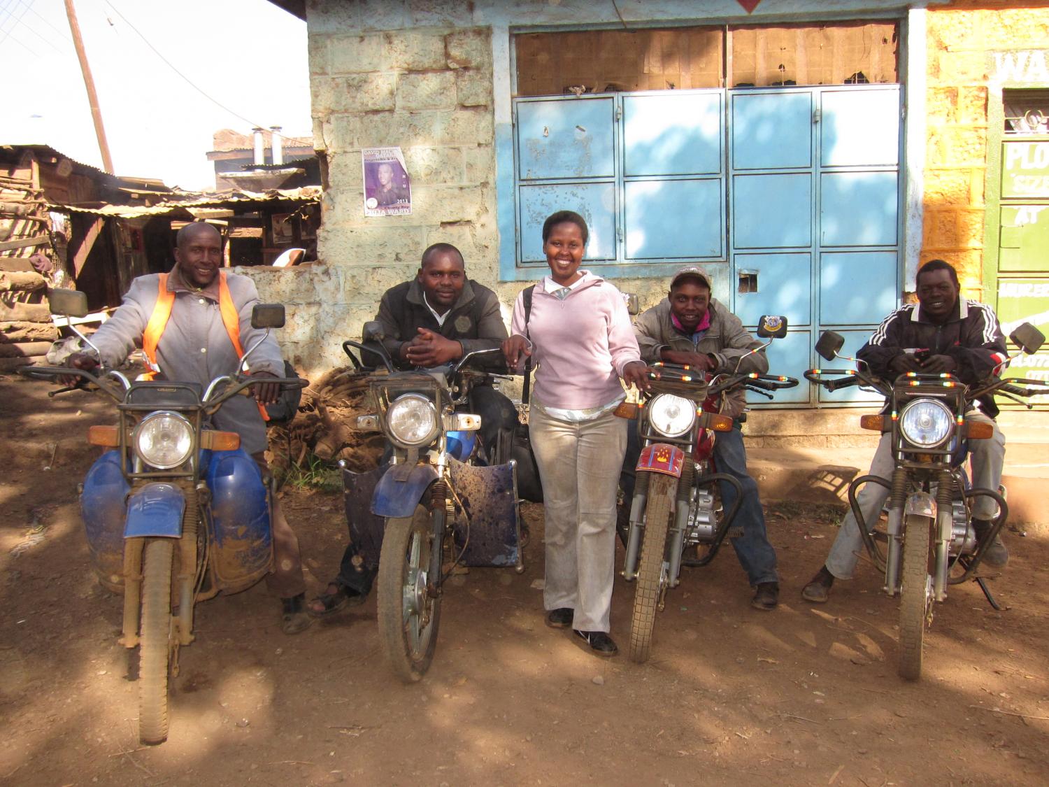 Kiva borrowers, their bikes, and their loan officer, Carol, are ready to roll in Kenya.