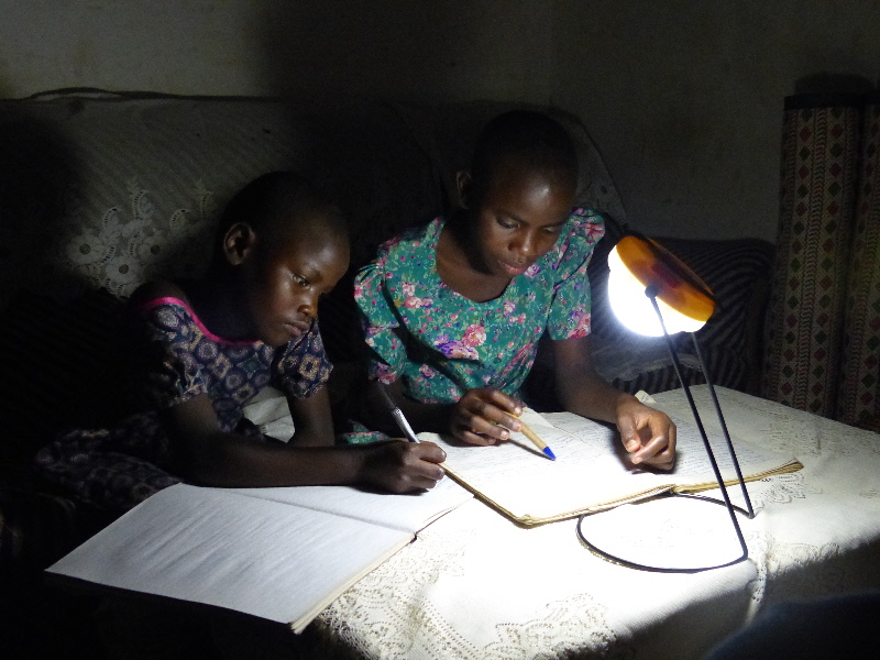 Stella and Rosie studying by solar light