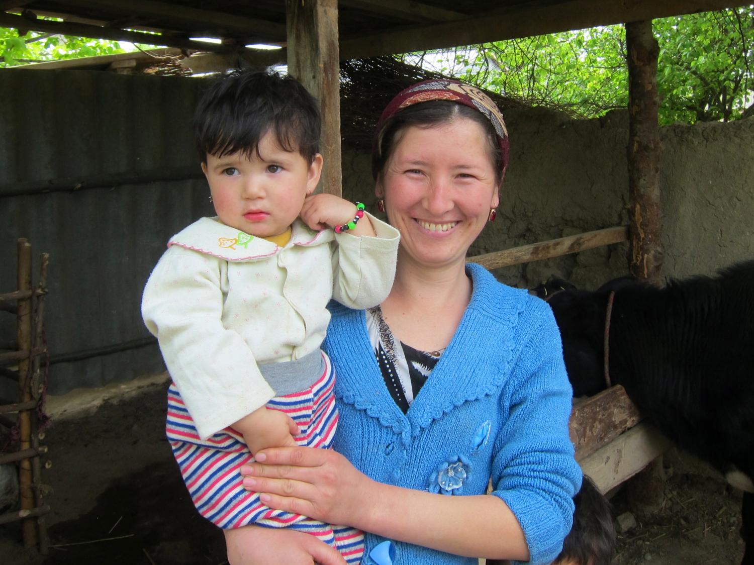 Marguba from Tajikistan and her daughter with the cow purchased with a Kiva Start-Up loan. Marguba purchased a pregnant cow and now has milk for her three children -- along with a mischievous little calf with a heart shaped spot on its head. Davinia Cogan, Tajikistan