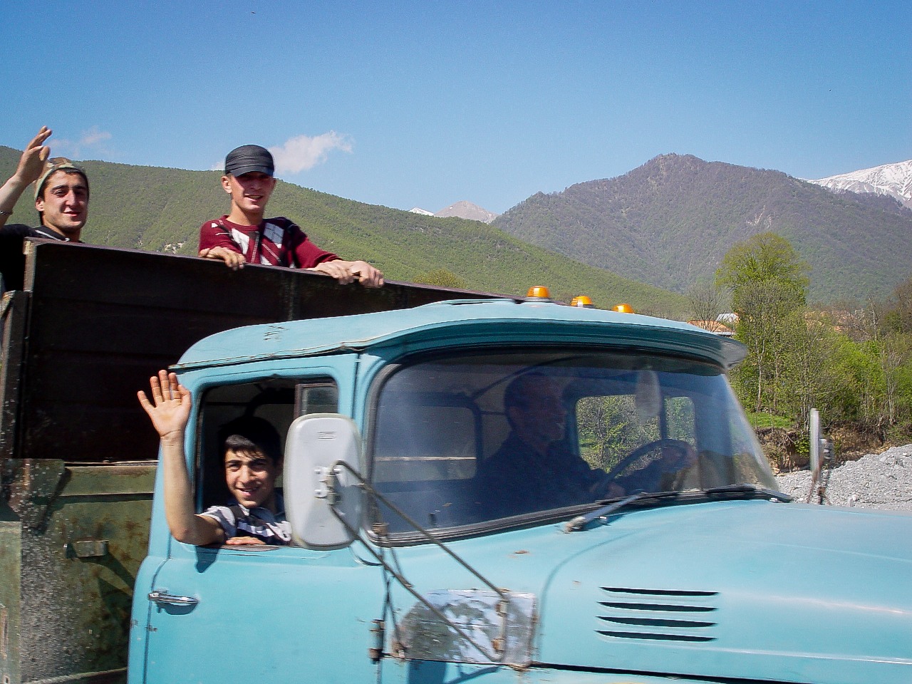 Locals passing on the road.