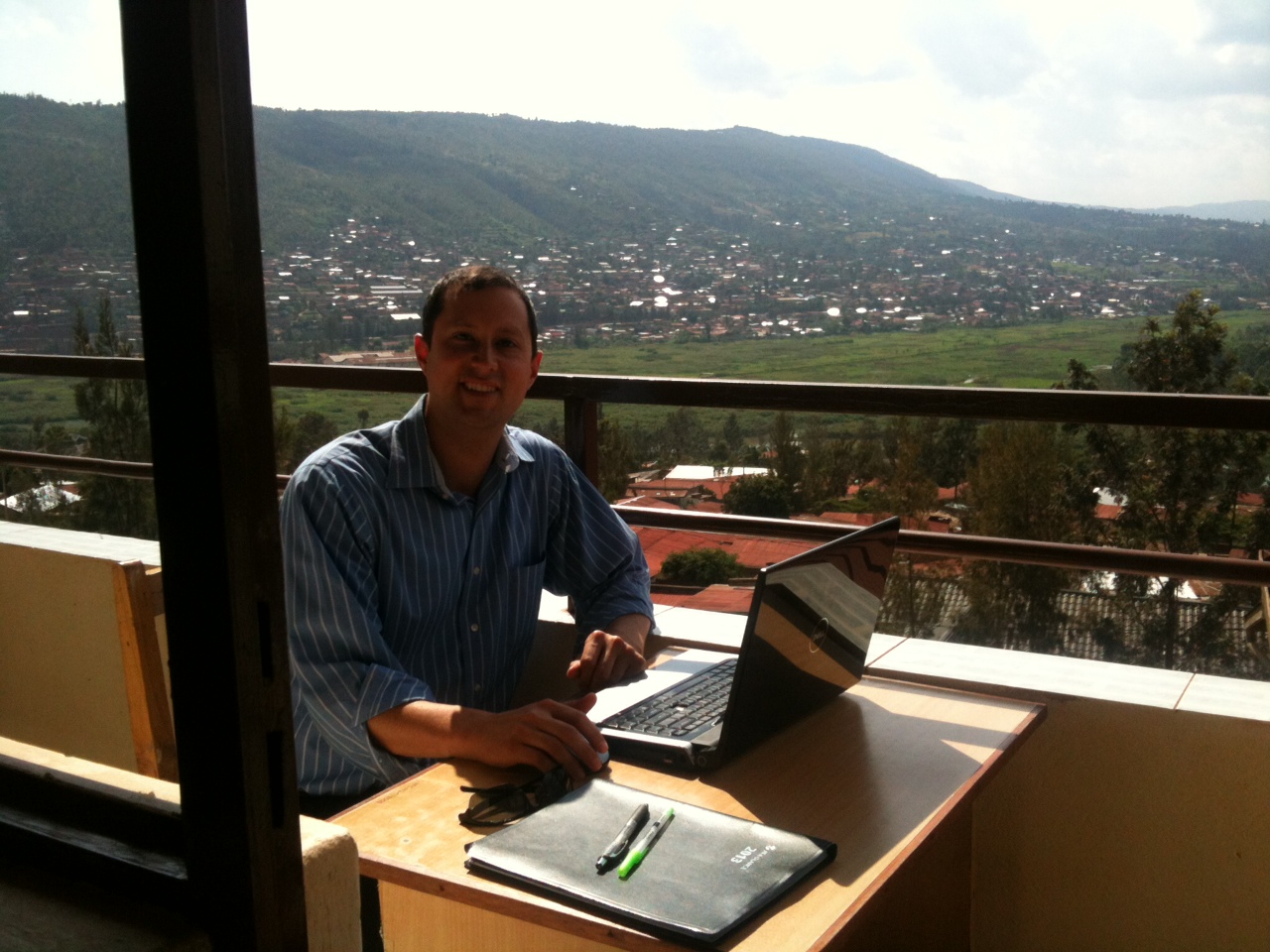 Kiva Fellow Mario soaking in the sun and scenic view from Vision Finance Company, Rwanda