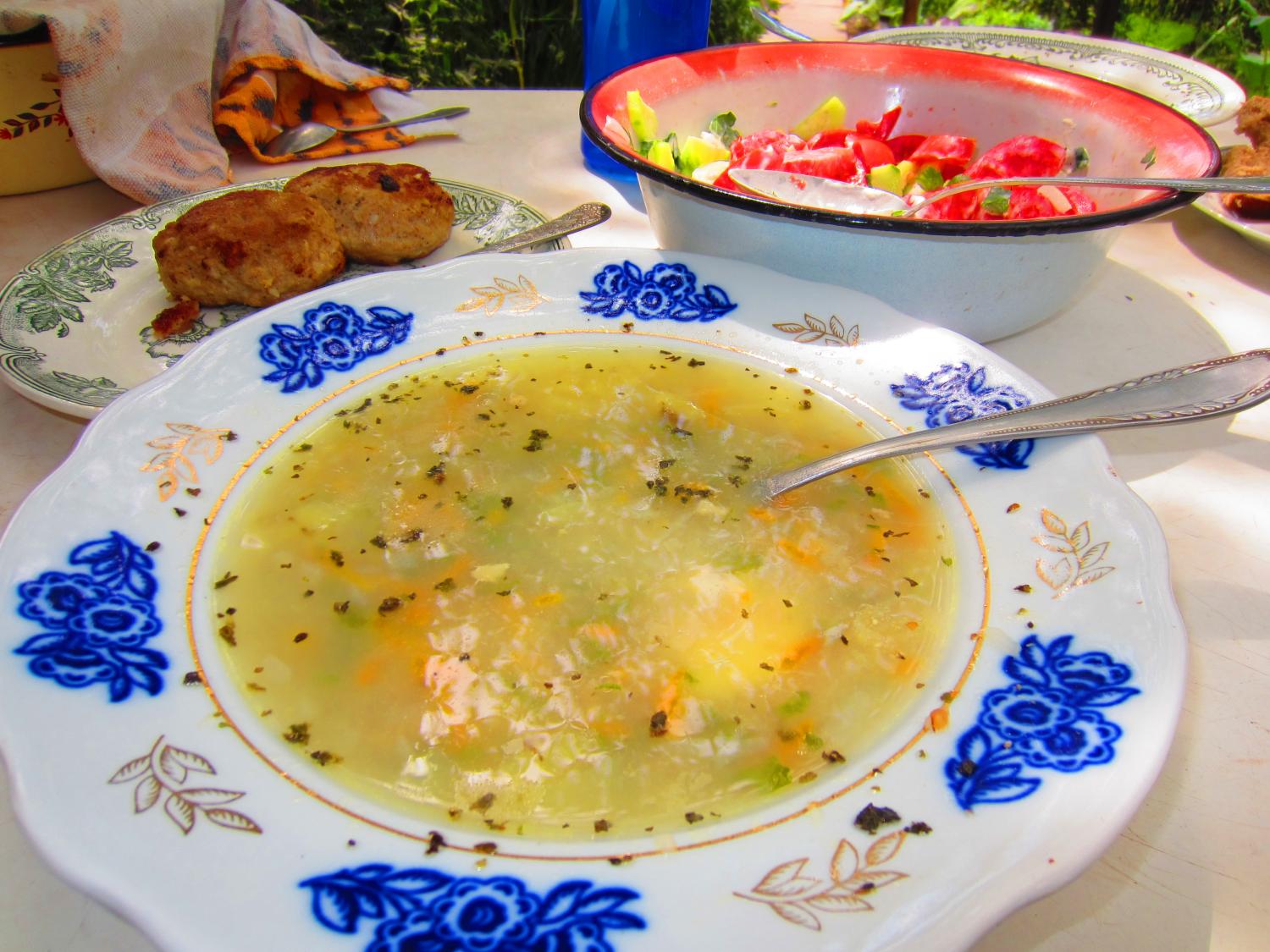 Potato soup with buckwheat, "cutlets" (fried hamburger mixed with bread), and a tomato and cucumber salad.