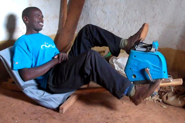 Marco operates his Nuru PowerCycle to charge a headlamp