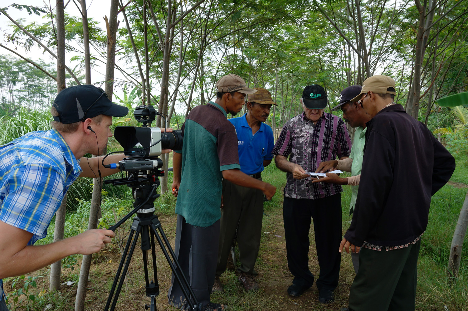 Group of initiative leaders discussing next steps. Photo credit: Yungkit