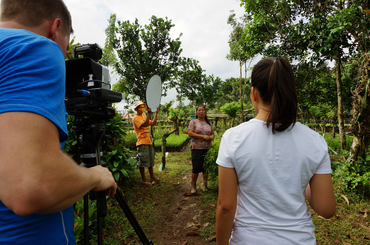 Interviewing the client, got another gardener to help as well. Photo credit: Yung Kit