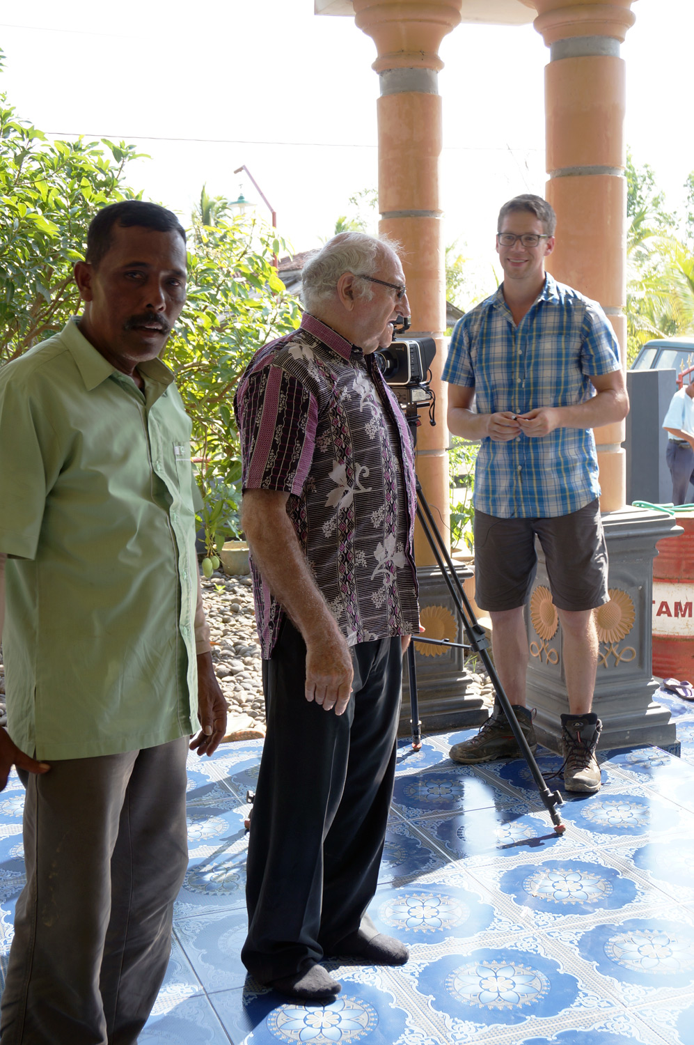 Town leader with Father Charlie and Mike. Photo credit: Yungkit