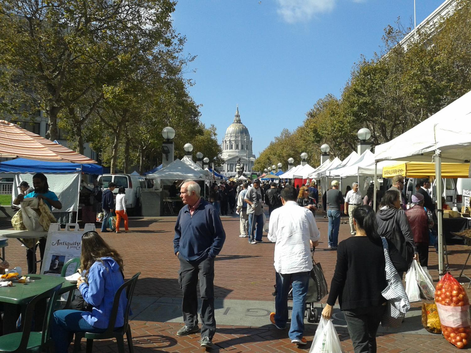 One of the many farmers' markets in the San Francisco Bay Area, with City Hall in the background.