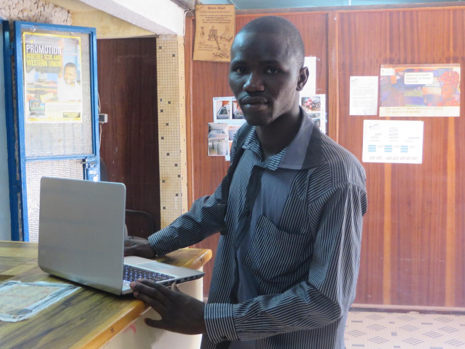 A loan of $425 combined with tutoring income helped Mahamoudou, 24, purchase a laptop for his bachelor’s degree