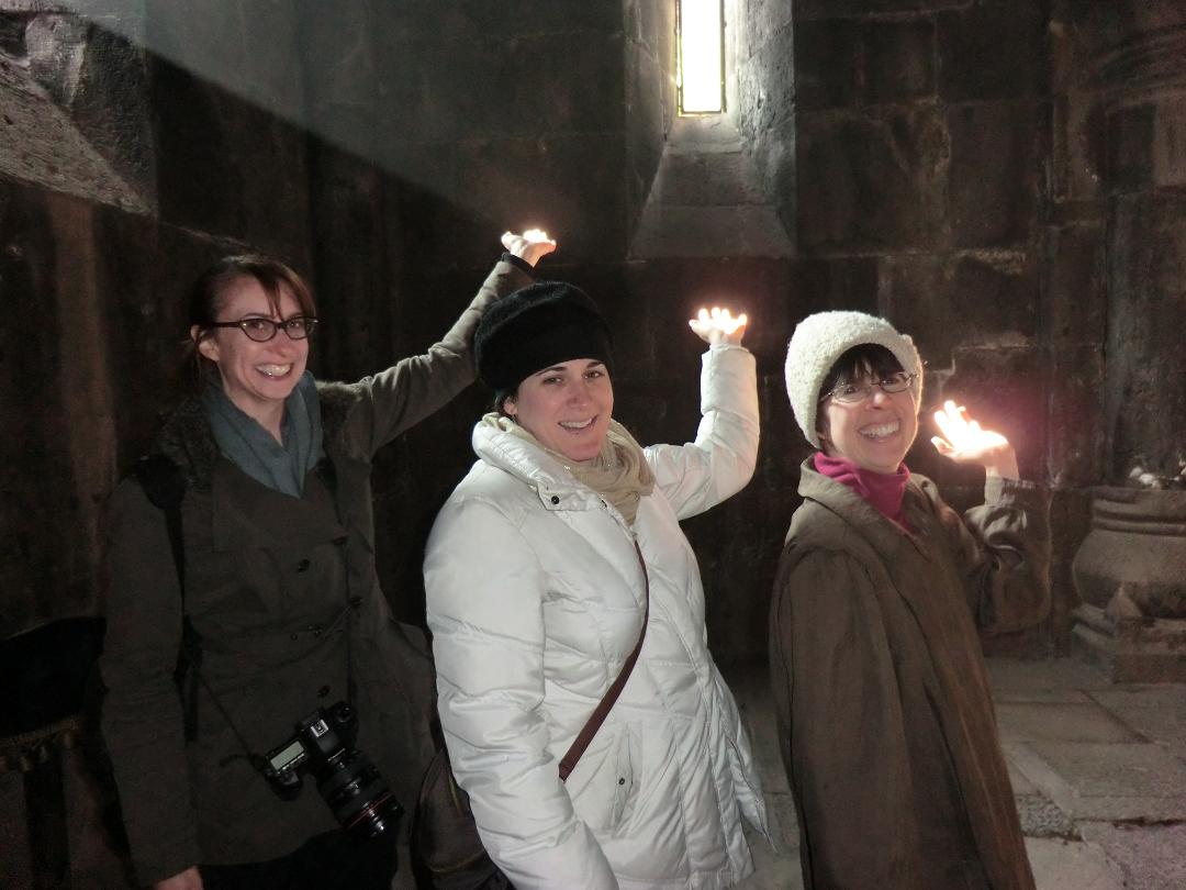 Liz, Shana and Amy holding sunlight beam in Gerhard