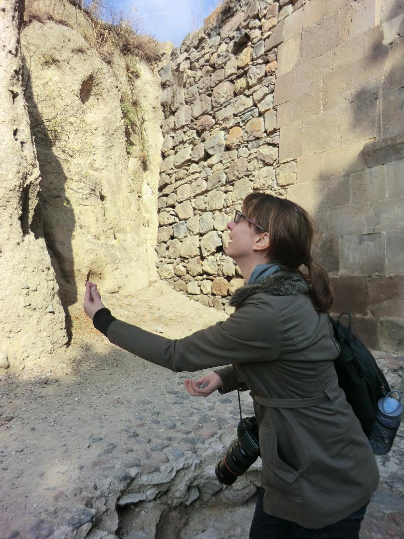 LIz throwing pebbles for luck at Gerhard
