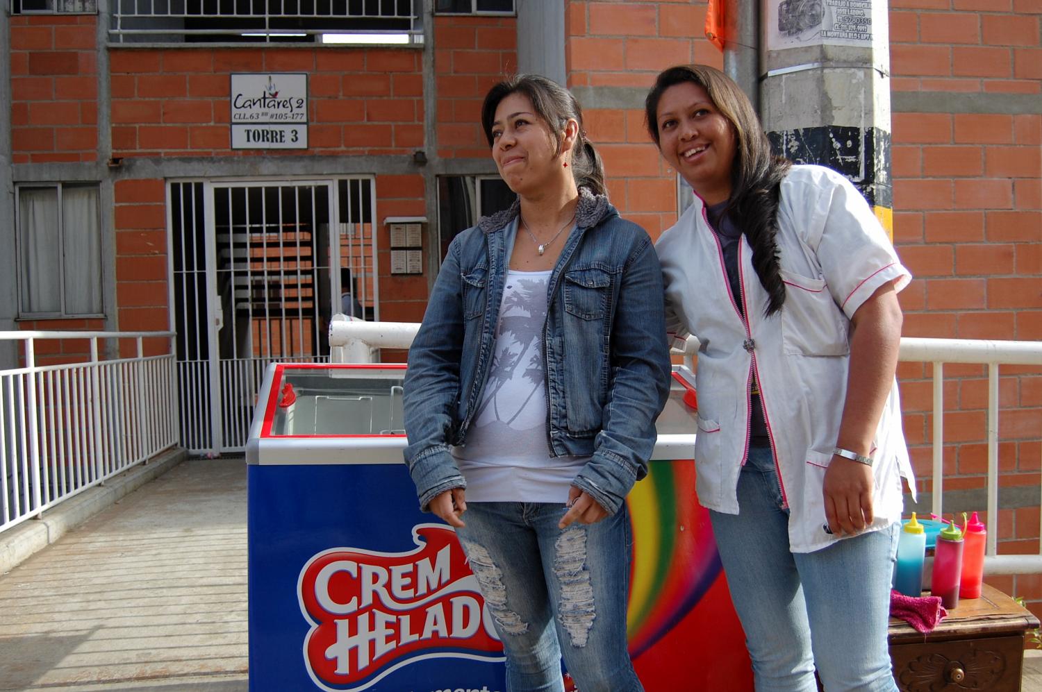 Kiva borrowers smile in front of their ice cream cart