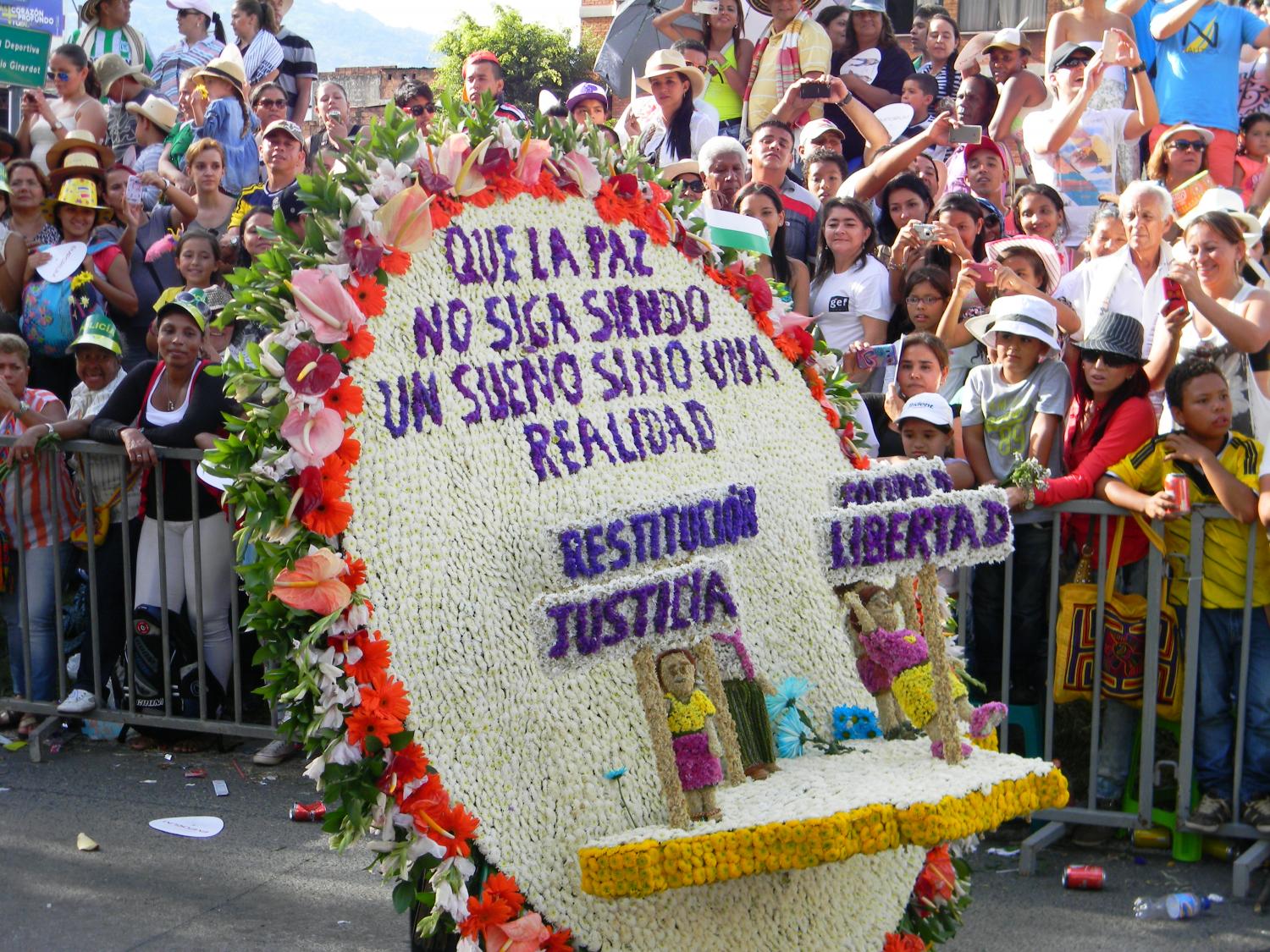 "Let Peace No Longer Be a Dream but a Reality"- One of several anti-war/ peace themed silletas as reminders of the continued armed conflict in the country.