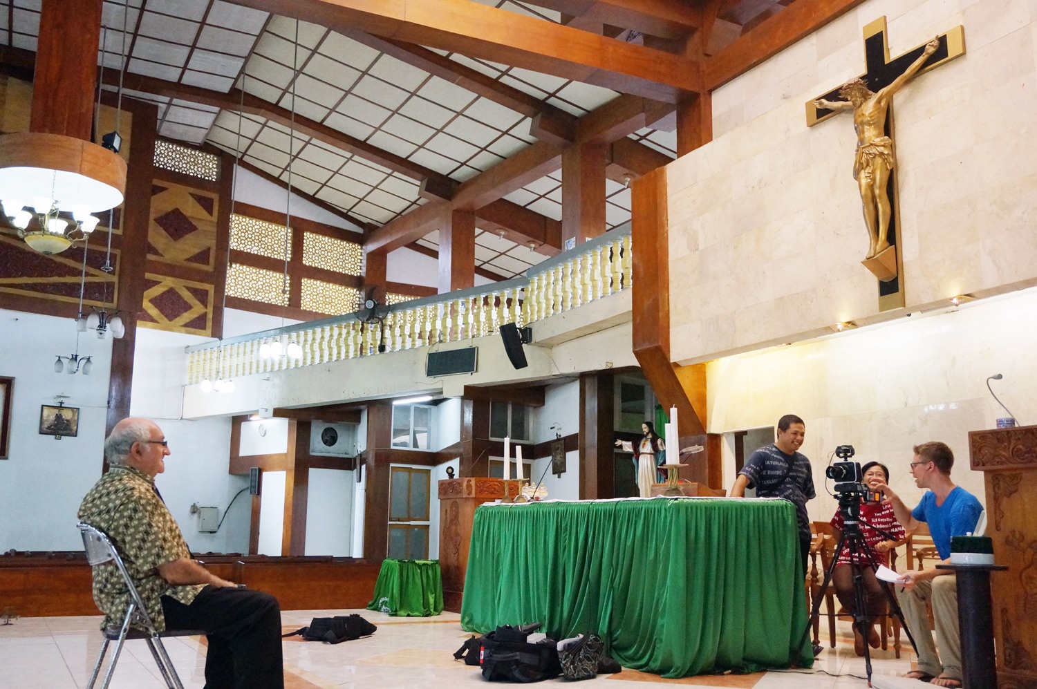 Interview set up at the Church with Father Charlie. Photo credit: Yungkit