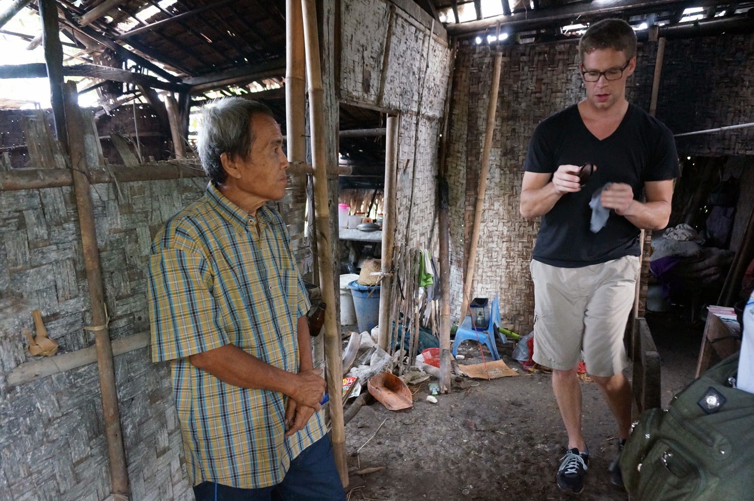 Paulos' father and I inside their home. Photo credit: Yungkit