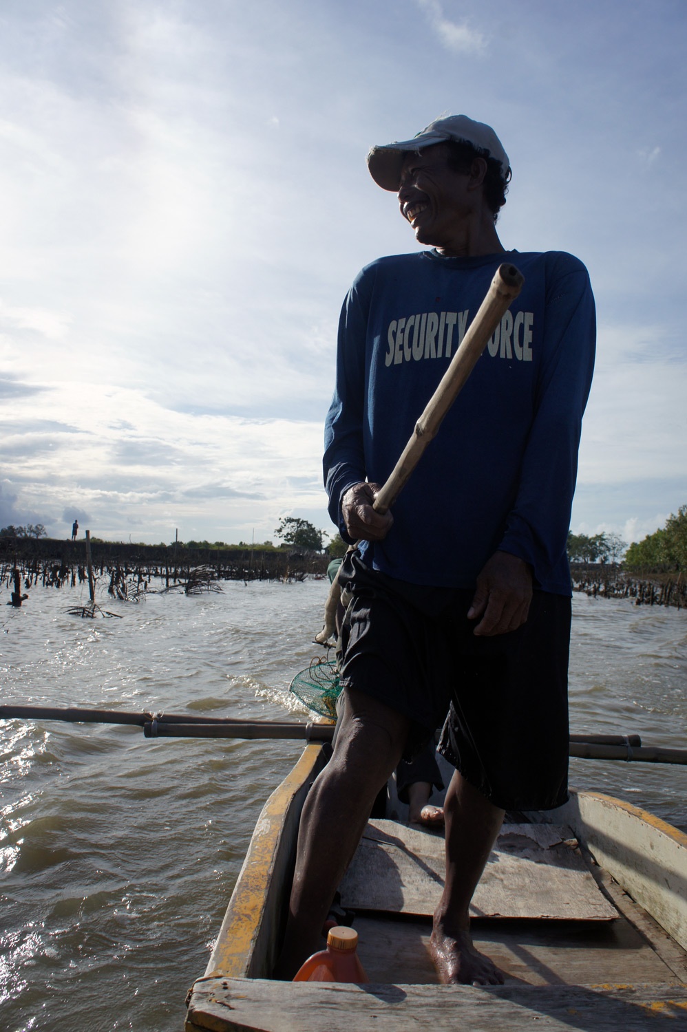 The boat captain. Camera shy. Photo credit: Yungkit