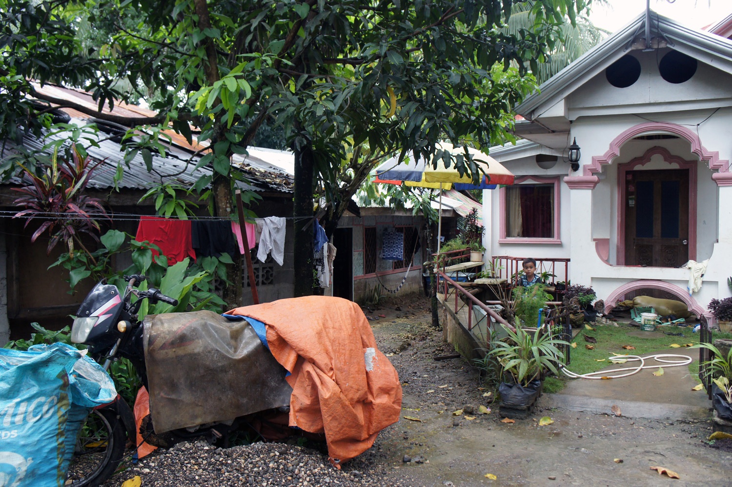 Levy's old home with the new addition after her business bloomed. Photo credit: Yungkit