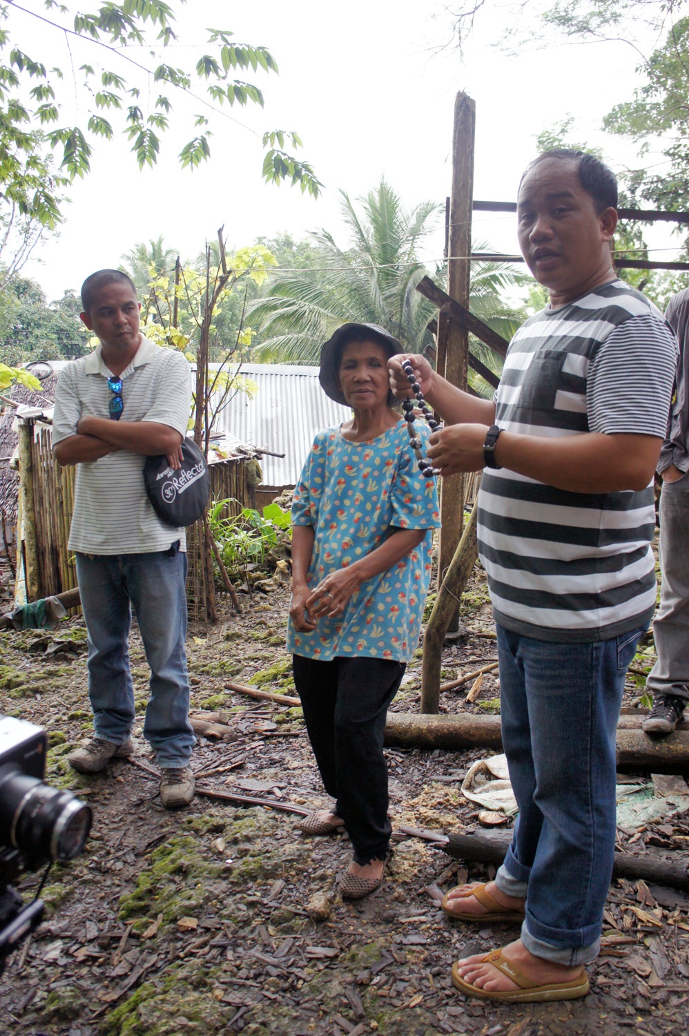 Andrew, a borrower and Pach. Photo credit: Yungkit