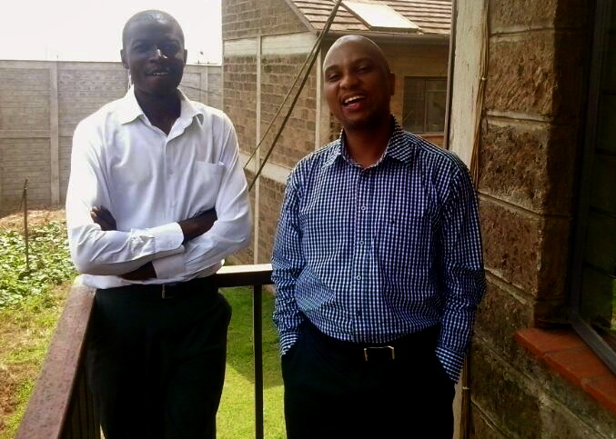 Davis Mkoji (right) with his borrower Wycliffe (left)