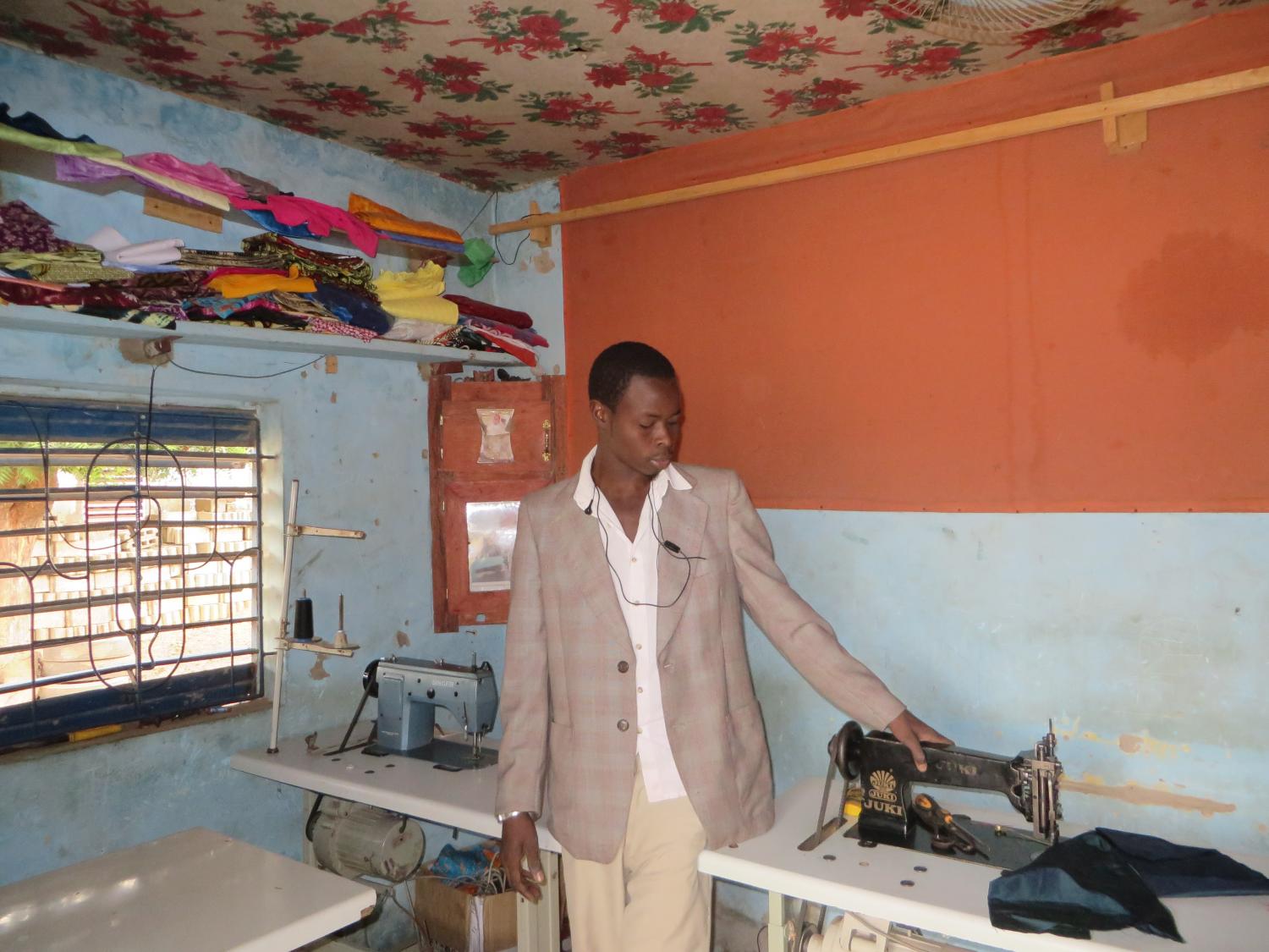 Birane, 25, showing us his recent purchases - Mbour (80 miles of Dakar)