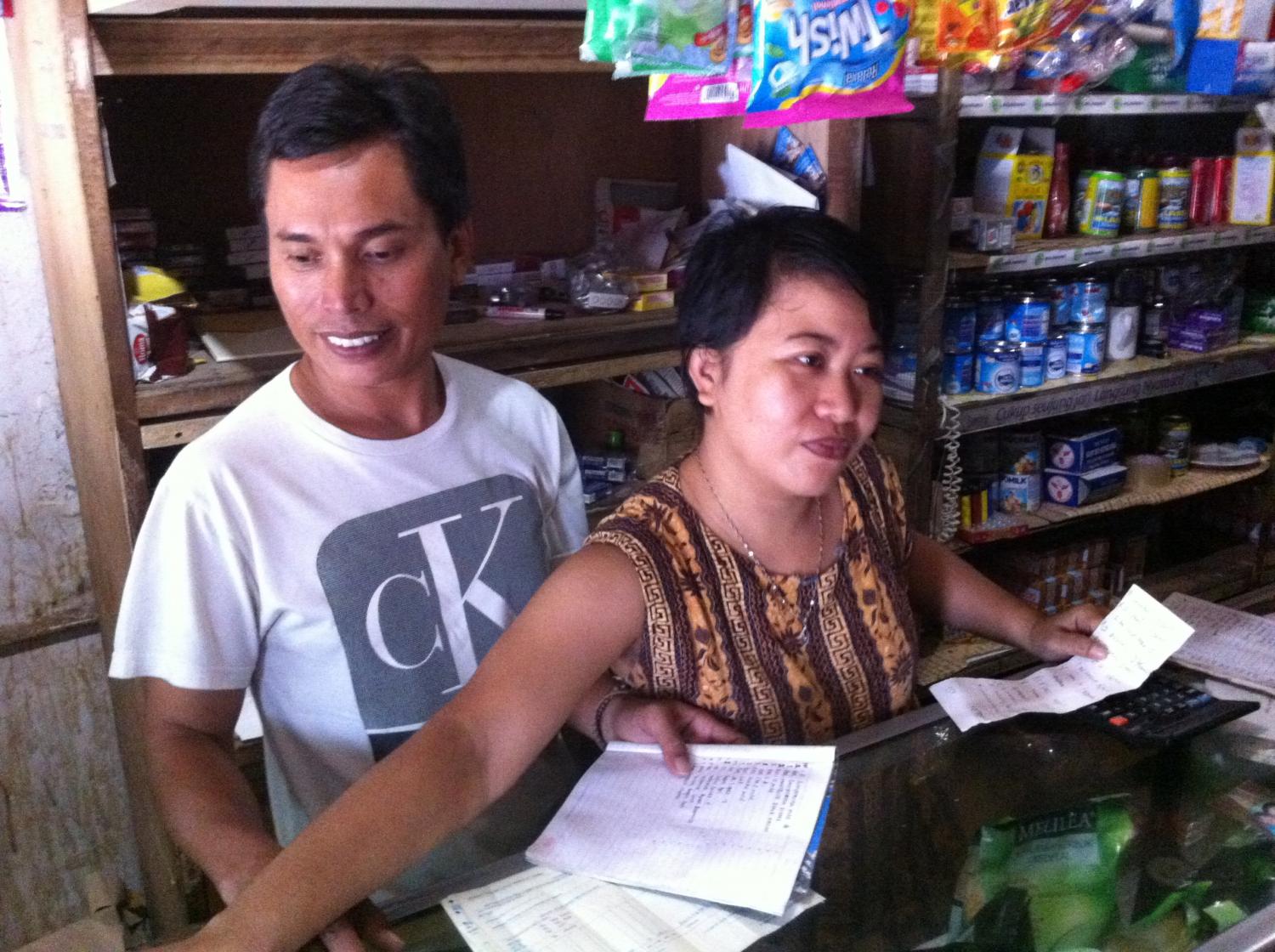 Ruma agents working at their shop (warung)