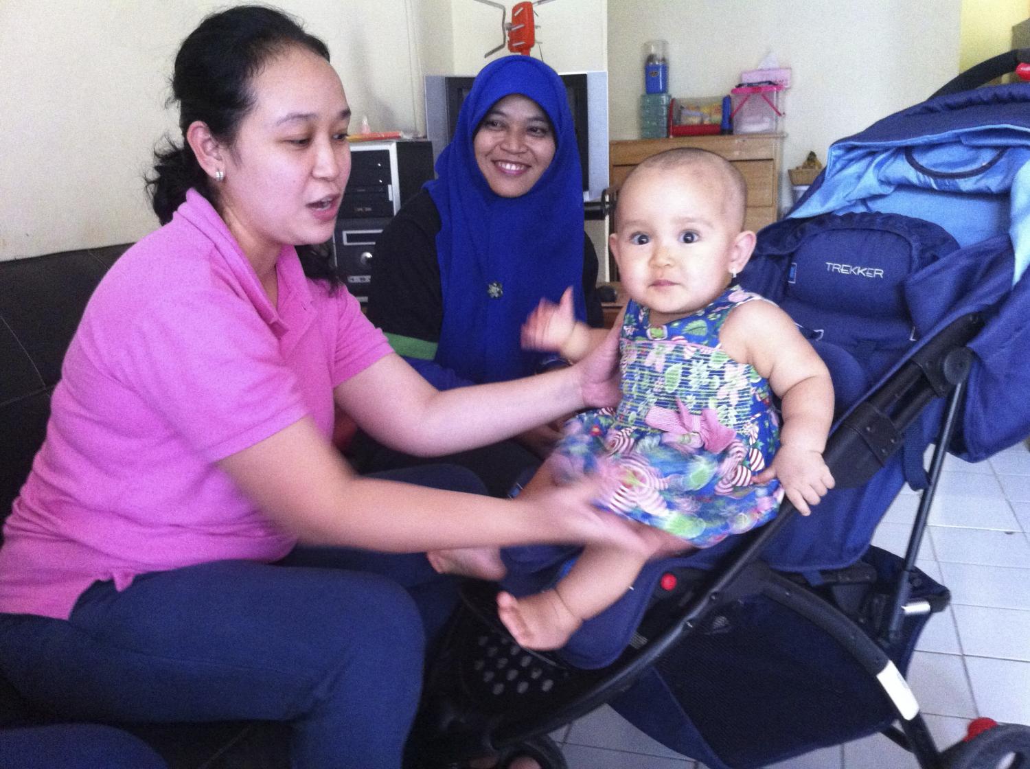 A Ruma agent at her home with her young child. Agents can work from their homes or existing stores, allowing for a flexible and convenient additional revenue stream