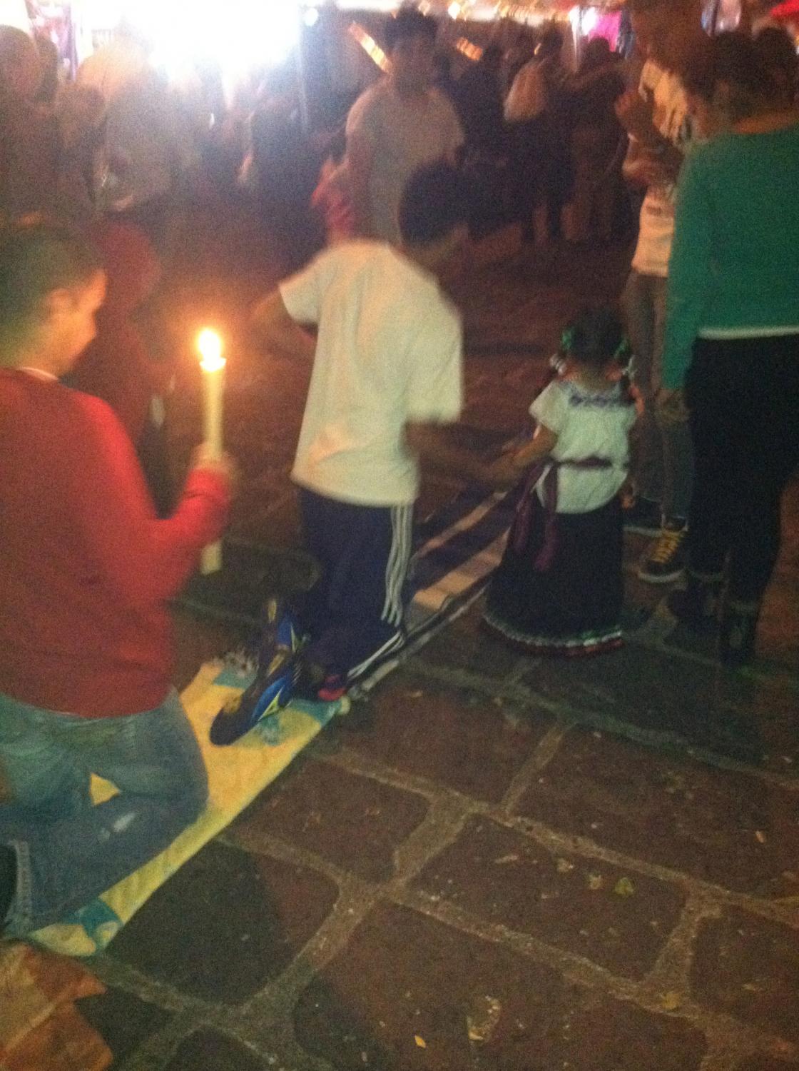 Crawling with the help of a miniature Virgin of Guadalupe