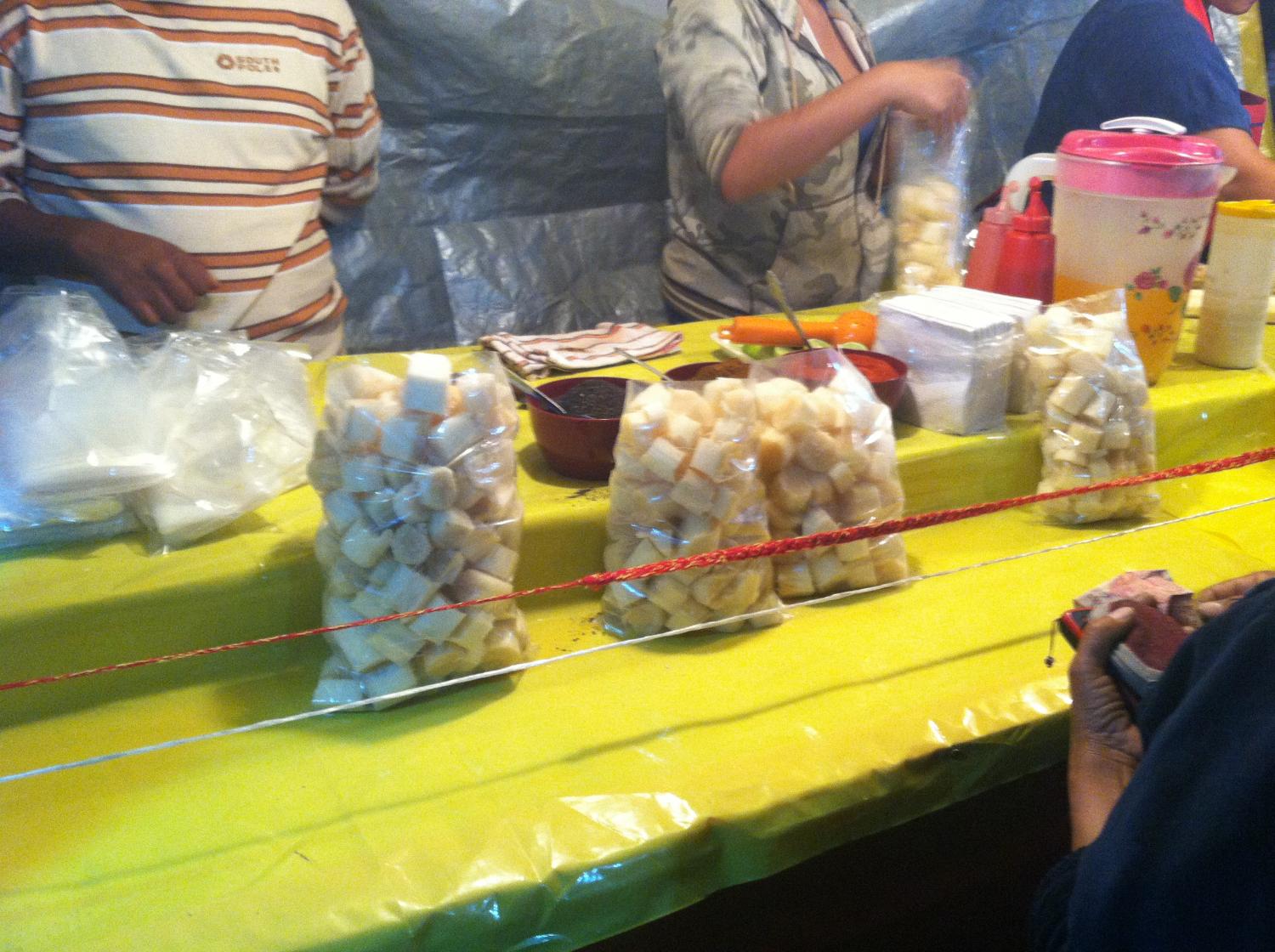 Sugar-cane. One of the many DELICIOUS foods being sold and spread around.