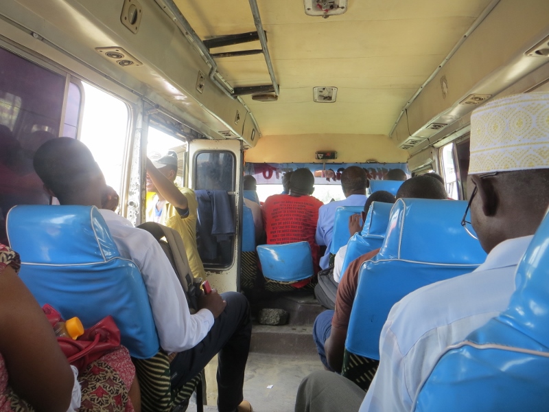 Inside Dala Dala before it gets packed -notice legs in the aisle because they don't fit