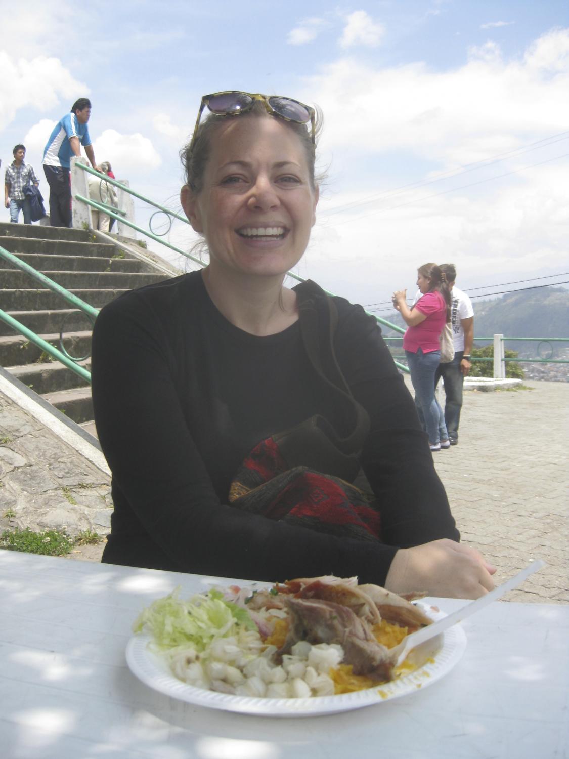 Kacki enjoying a version of 'fritada' on top of Panecillo in Quito.